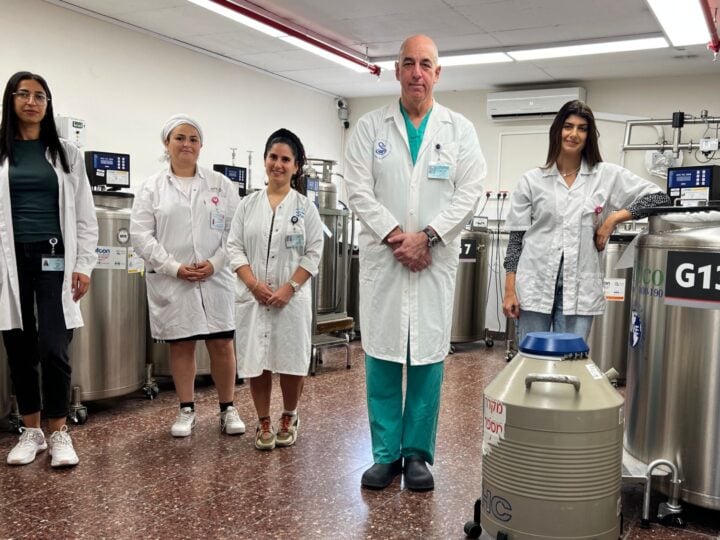 Prof. Micha Baum, head of Sheba Medical Centerâ€™s sperm bank, with his staff. Photo courtesy of Sheba