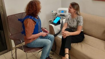 Tal Tzfoni with a patient in a trial of the LibAirty device. Photo courtesy of Synchrony Medical