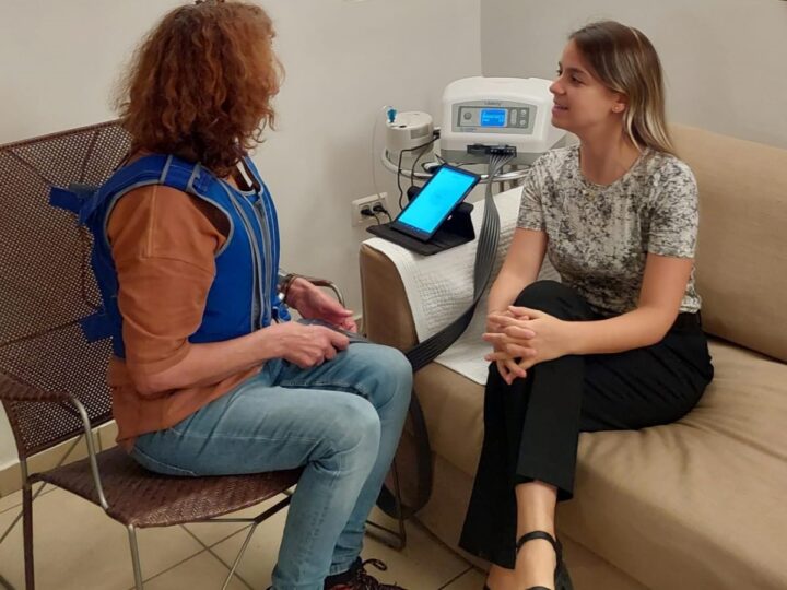 Tal Tzfoni with a patient in a trial of the LibAirty device. Photo courtesy of Synchrony Medical