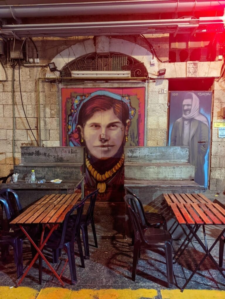 This market stall in Machane Yehudaâ€™s Agas (Pear) Street now sports portraits of the original houseâ€™s owners, Bachora and Meir Banai. Photo by Solomon Souza