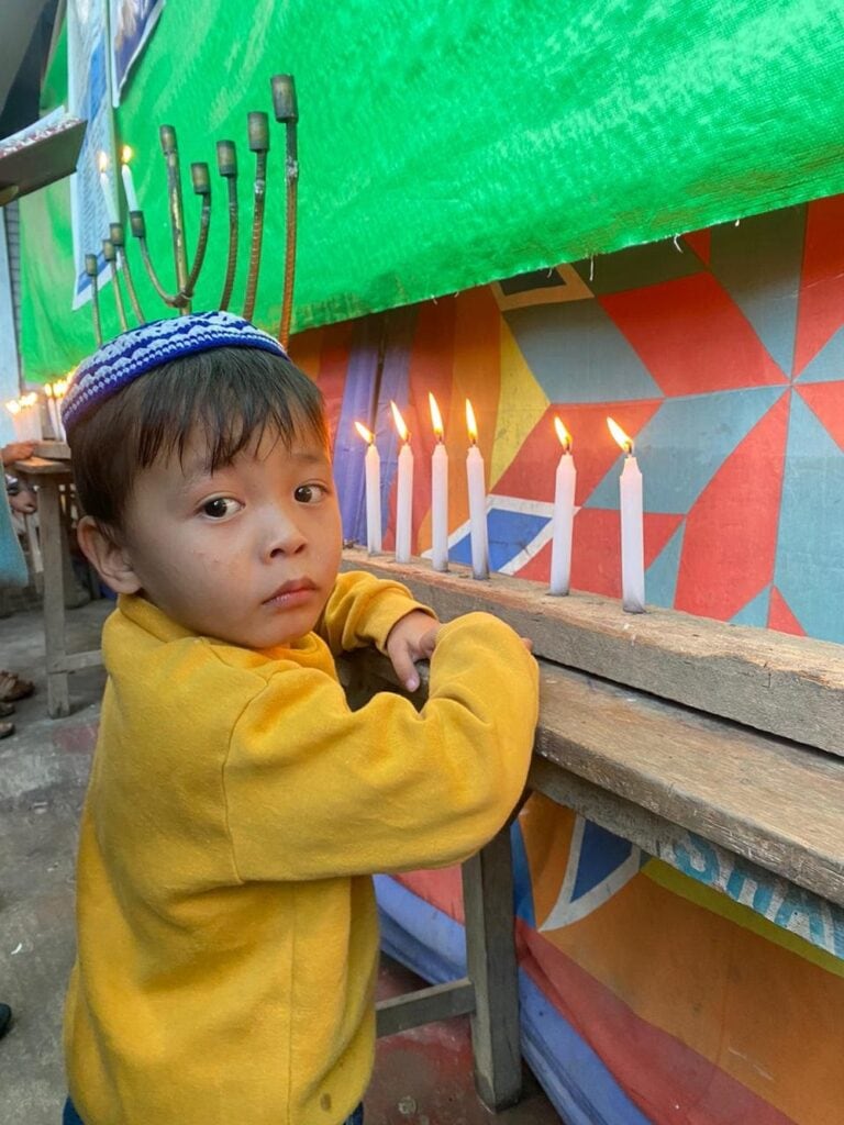 Three-year-old Ezra Janggousang at the Hanukkah candle-lighting ceremony. Photo courtesy of Shavei Israel