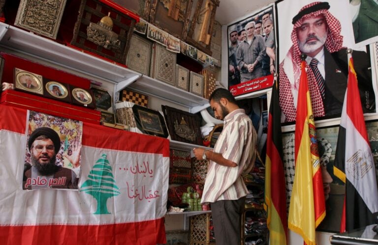 A poster of Hezbollah leader Hassan Nasrallah, Lebanon's flag and Palestinian leaders displayed at a store in Gaza City in 2008. Photo by Wissam Nassar/Flash90