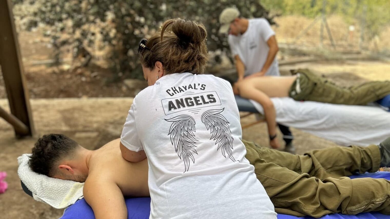 Alternative medical practitioners volunteering with soldiers through Chayalâ€™s Angels. Photo by Tasha Cohen