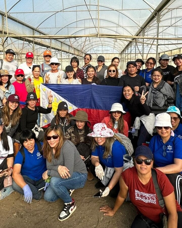 Filipino volunteers on an Israeli farm. Photo by Brian Noel
