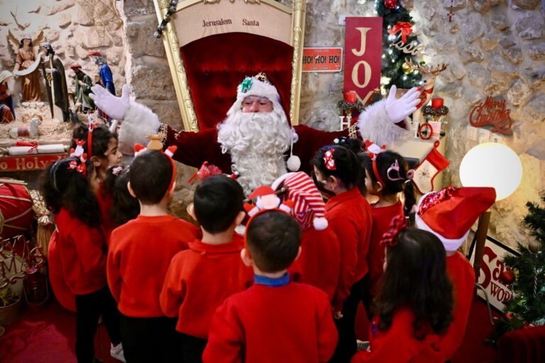Issa Kassissieh, the Jerusalem Santa, welcoming children to the Santa House in Jerusalemâ€™s Old City. Photo courtesy of Issa Kassissieh