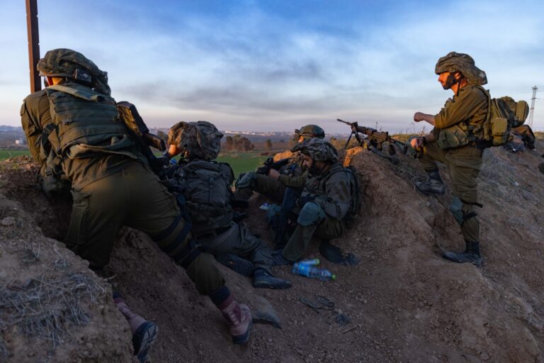 Israeli soldiers take position near the border fence with the Gaza Strip, January 7, 2024. Photo by Chaim Goldberg/Flash90