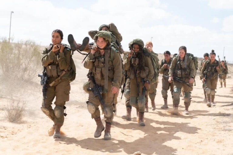 Female soldiers carry heavy loads. Photo courtesy of IDF