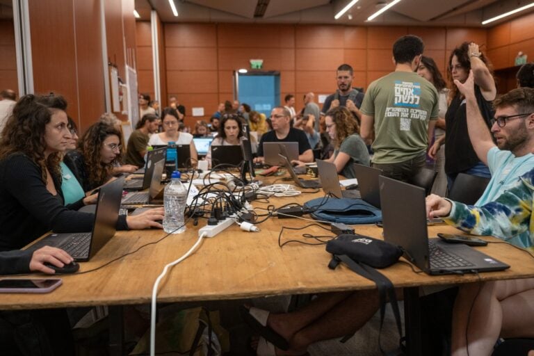 Volunteers in the war room at Expo Tel Aviv in the first weeks after October 7. Photo by Nati Marcus