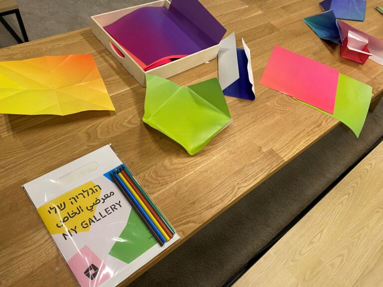 The creativity kit distributed to kids across Israel, on a table where young visitors to the Tel Aviv Museum of Art create origami. Photo by Abigail K. Leichman