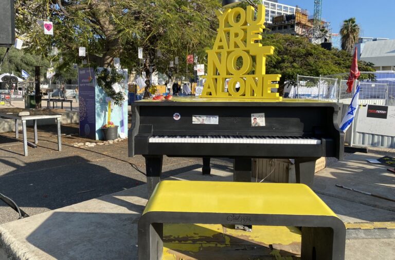 A poignant message perched on a piano in Hostages and Missing Square in Tel Aviv. Photo by Abigail K. Leichman
