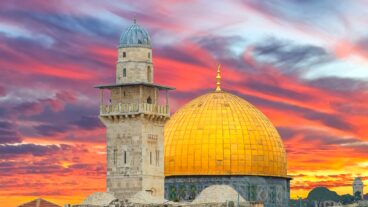 Sunrise above golden Dome of the Rock and al-Aqsa Mosque on the Temple Mount in Old City of Jerusalem. Photo by Sergei2 via Shutterstock.com