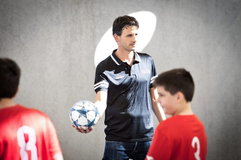 A former helicopter pilot in the IAF, Yaniv Kusevitzky is using skills he learned there to help build kids confidence through soccer. Photo by Noam Chen