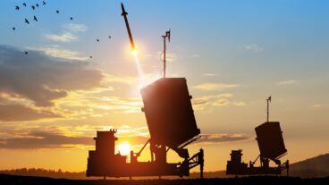 Israel's Iron Dome air-defense missile launches, aimed at the sky at sunset. Photo by Hamara via Shutterstock.com