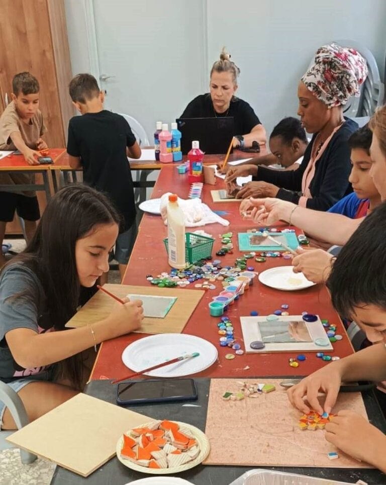 Mosaic workshop for evacuees at Givat Haviva. Photo by Jesse Colton