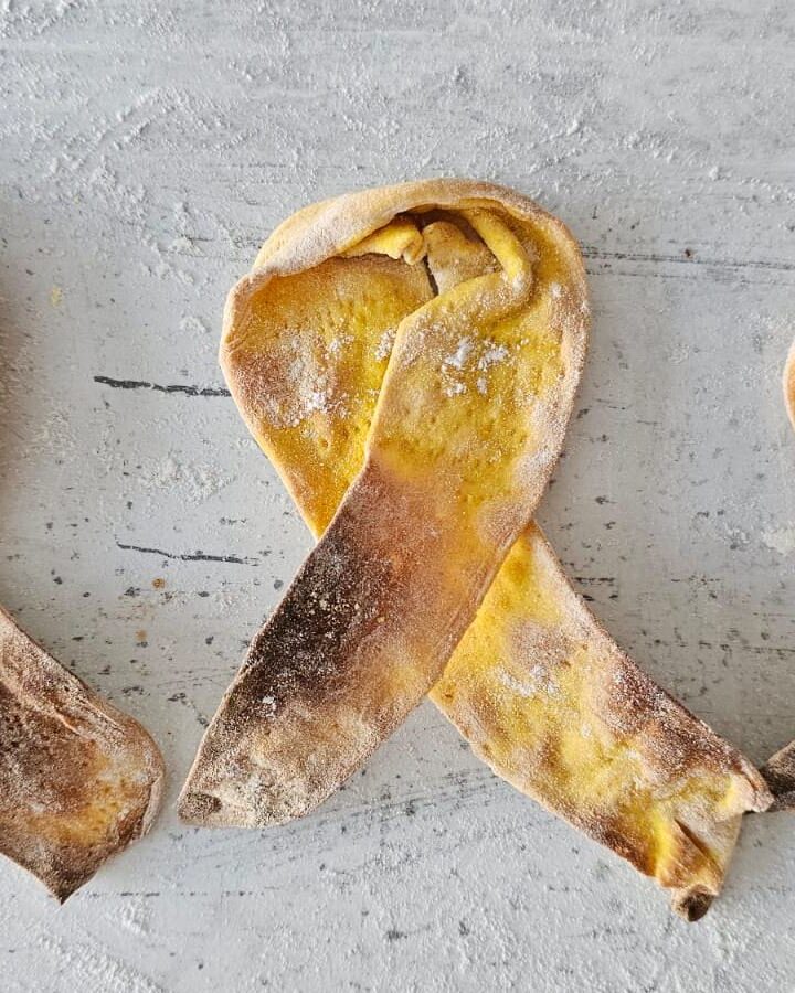 Idan Chabasov uses turmeric to make matzah resembling the yellow ribbons showing solidarity with the hostages in Gaza. Photo courtesy of Challah Prince
