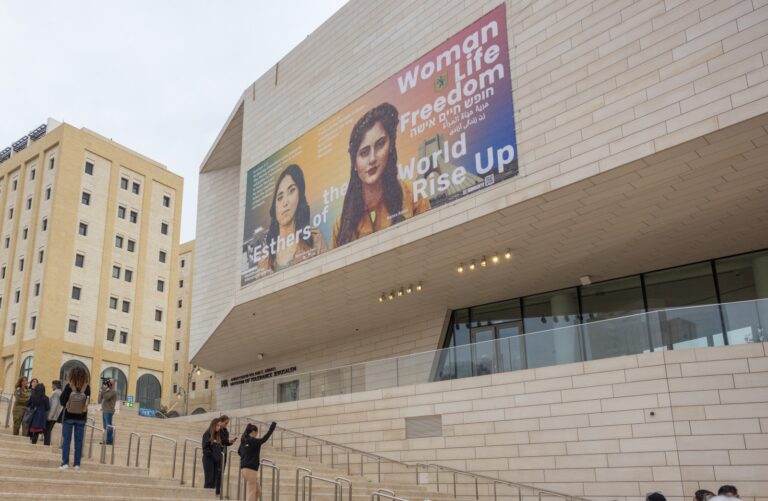 The mural showing Shirel Haim Pour and Mahsa Amini hangs atop the Jerusalem Museum of Tolerance. Picture courtesy of Hooman Khalili