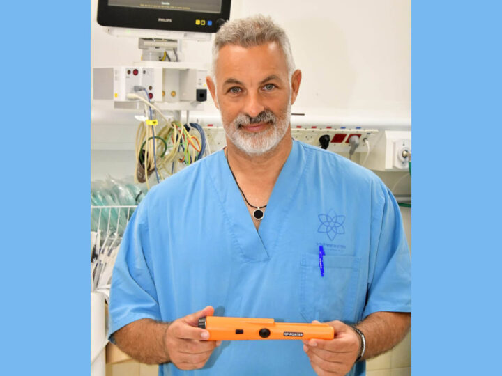 Head and neck surgeon Dr. Eyal Sela with the metal detector. Photo by Roni Albert