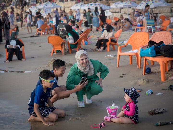 Muslims enjoy the sea by Tel Aviv during Eid al-Adha, on July 1, 2023. Photo by Miriam Alster/Flash90